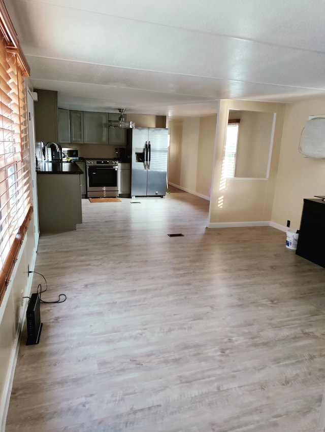1012 Old Colony Rd Lot 85, Meriden, CT 06451 - unfurnished living room with light wood-type flooring and baseboards