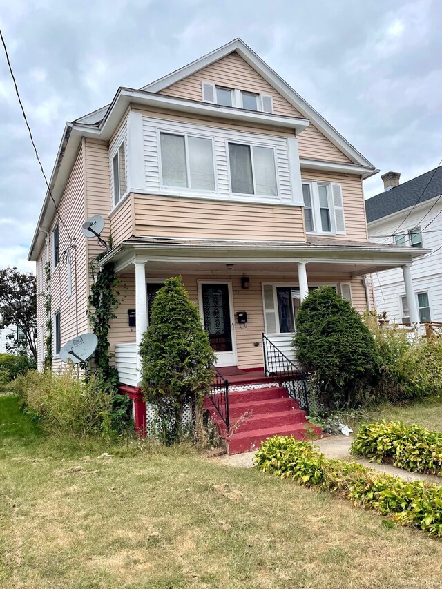 190 Holcomb St, Hartford, CT 06112 - traditional style home featuring a porch and a front lawn