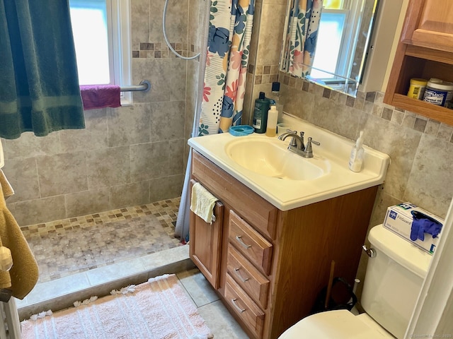190 Holcomb St, Hartford, CT 06112 - bathroom featuring a tile shower, toilet, vanity, and tile walls