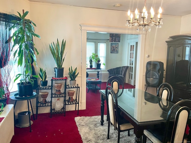 190 Holcomb St, Hartford, CT 06112 - dining space featuring a chandelier, carpet, and crown molding