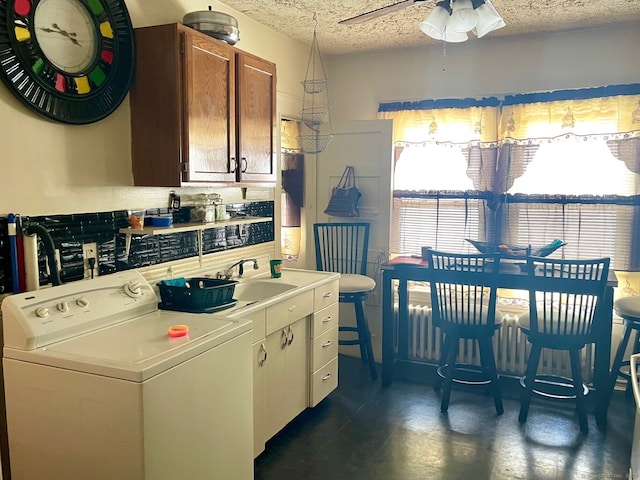 190 Holcomb St, Hartford, CT 06112 - kitchen with washer / clothes dryer, a textured ceiling, light countertops, a ceiling fan, and a sink
