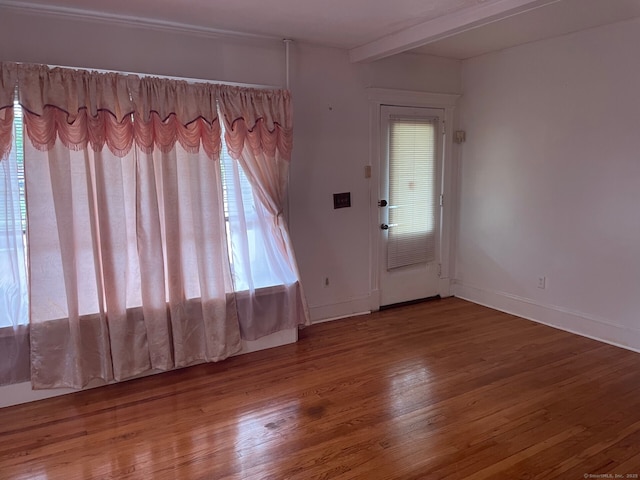 190 Holcomb St, Hartford, CT 06112 - foyer entrance with healthy amount of natural light, wood finished floors, and baseboards