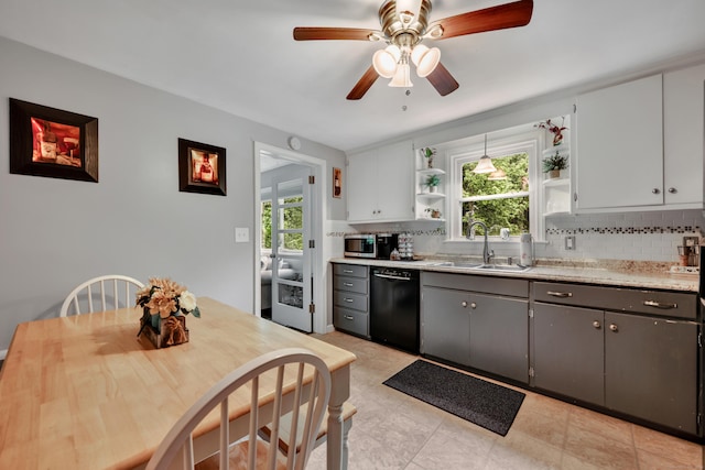 314 Old Wolcott Rd, Bristol, CT 06010 - kitchen with black dishwasher, open shelves, a sink, backsplash, and stainless steel microwave