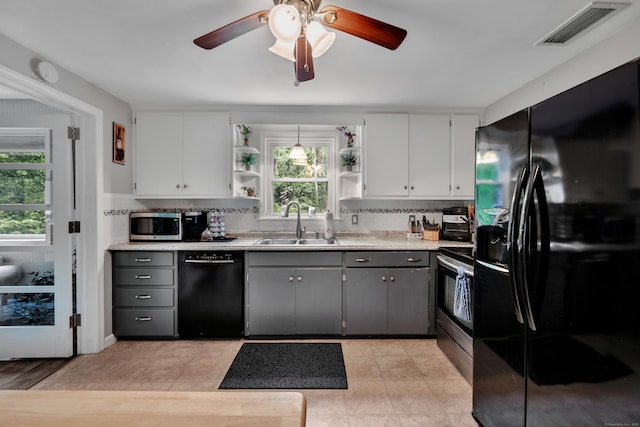 314 Old Wolcott Rd, Bristol, CT 06010 - kitchen with black appliances, a sink, open shelves, white cabinetry, and light countertops