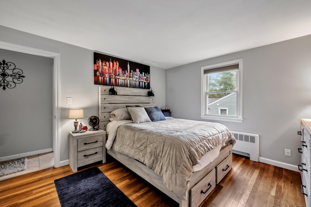 314 Old Wolcott Rd, Bristol, CT 06010 - bedroom featuring radiator heating unit, wood finished floors, and baseboards
