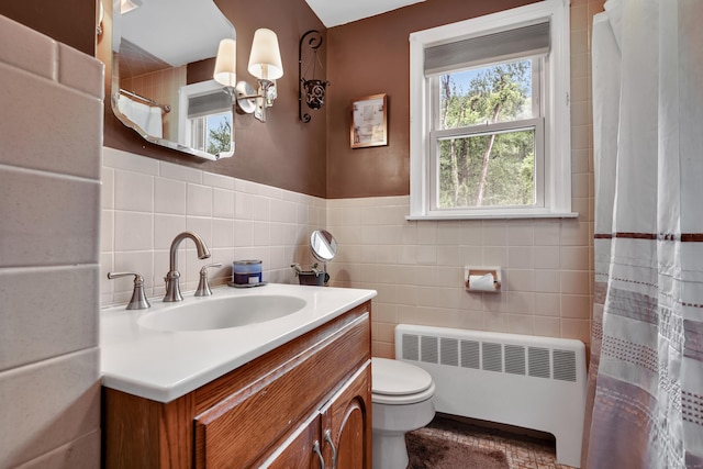 314 Old Wolcott Rd, Bristol, CT 06010 - full bathroom featuring radiator heating unit, tile walls, toilet, vanity, and a shower with curtain