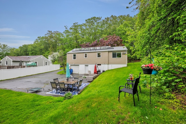 314 Old Wolcott Rd, Bristol, CT 06010 - rear view of property with a patio and a garage