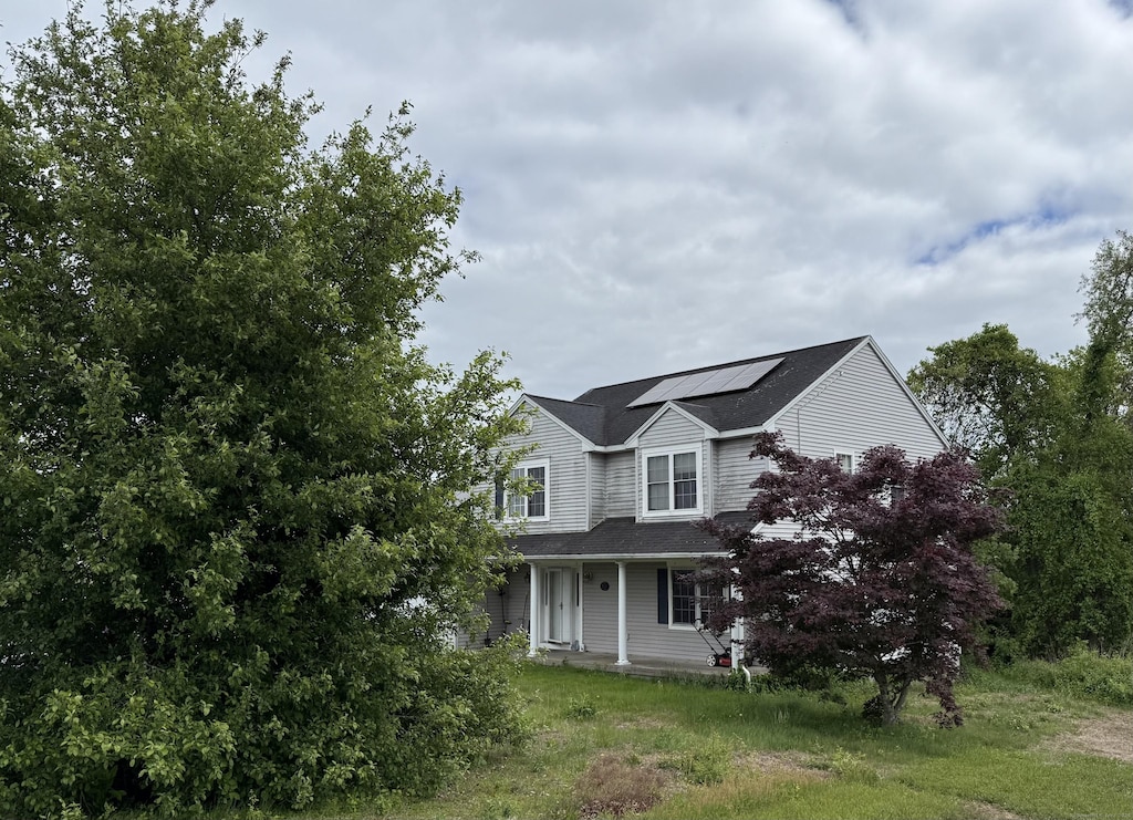 287 D Welton Way, Thomaston, CT 06787 - view of front of home featuring roof mounted solar panels and a porch