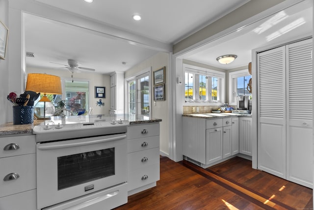 15 Attawan Ave, East Lyme, CT 06357 - kitchen with electric range, dark wood-style floors, plenty of natural light, a ceiling fan, and beam ceiling