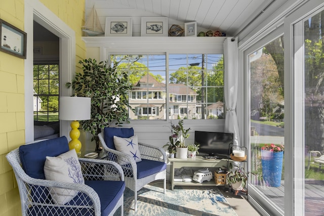 15 Attawan Ave, East Lyme, CT 06357 - sunroom featuring vaulted ceiling and concrete block wall