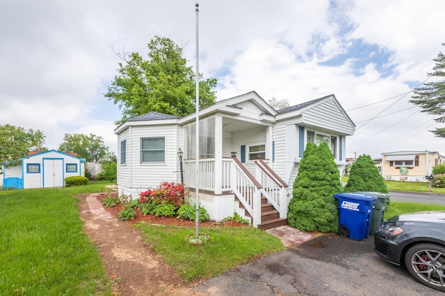 2 Oak Rd, Southington, CT 06489 - view of front of home featuring a front yard, a storage shed, and an outdoor structure