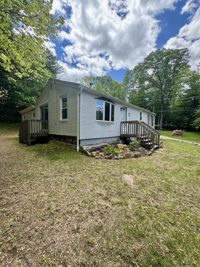 616 Crystal Lake Rd, Tolland, CT 06084 - view of home's exterior featuring a yard and a deck