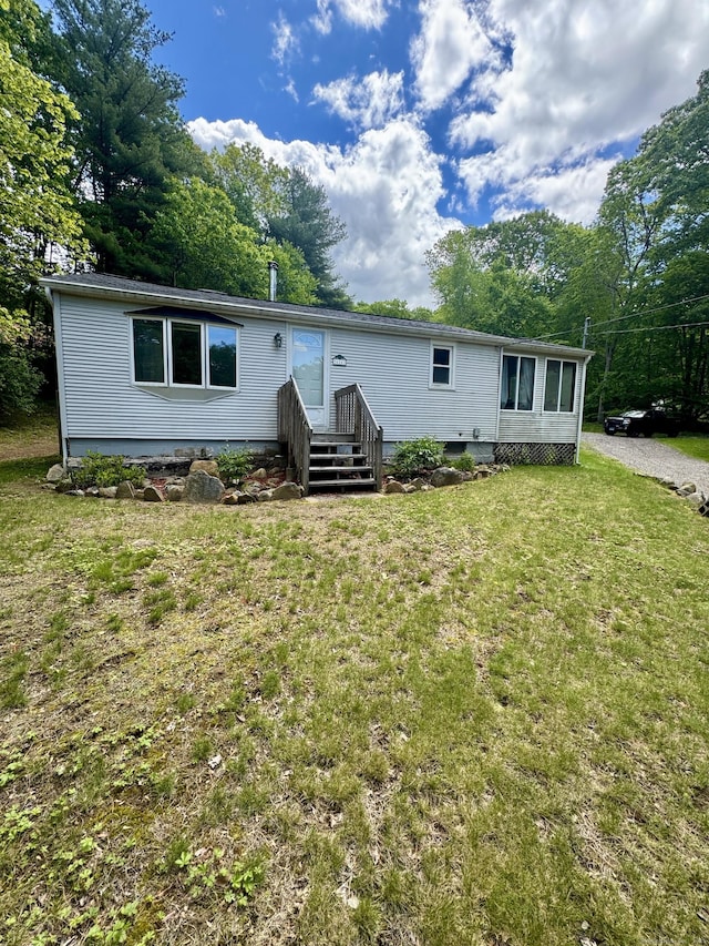 616 Crystal Lake Rd, Tolland, CT 06084 - manufactured / mobile home with a front yard and view of wooded area