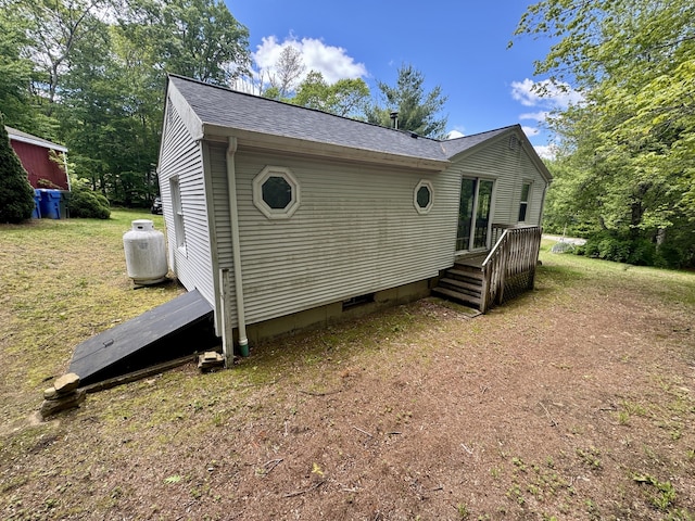 616 Crystal Lake Rd, Tolland, CT 06084 - view of side of property with roof with shingles, a deck, crawl space, and a lawn
