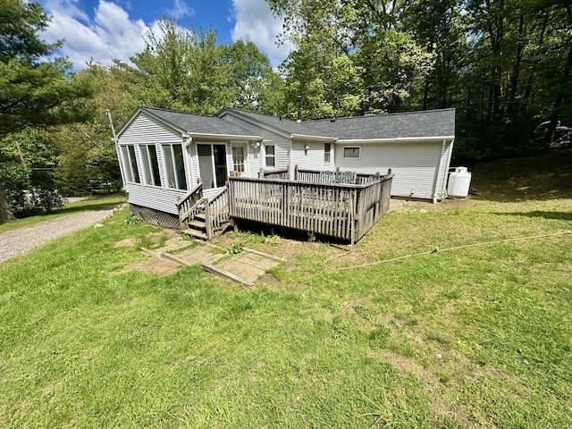 616 Crystal Lake Rd, Tolland, CT 06084 - back of property featuring a wooden deck and a lawn
