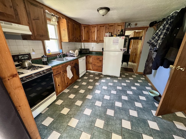 616 Crystal Lake Rd, Tolland, CT 06084 - kitchen with white appliances, under cabinet range hood, a sink, decorative backsplash, and a textured ceiling