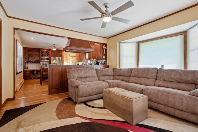 10 Colonial Dr, Clinton, CT 06413 - living room with ceiling fan, light wood-style flooring, a baseboard heating unit, and crown molding