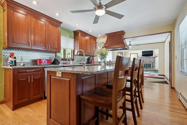 10 Colonial Dr, Clinton, CT 06413 - kitchen with a ceiling fan, premium range hood, light wood-style flooring, and recessed lighting