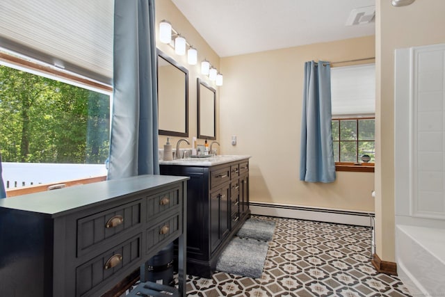 10 Colonial Dr, Clinton, CT 06413 - bathroom with a baseboard radiator, vanity, baseboards, and a tub