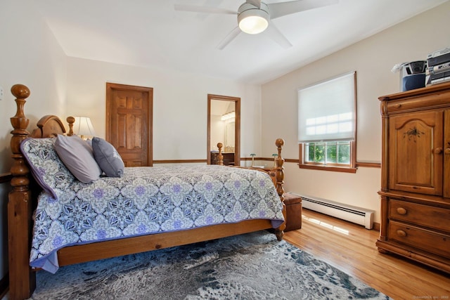 10 Colonial Dr, Clinton, CT 06413 - bedroom featuring baseboard heating, light wood-style floors, ceiling fan, and ensuite bath