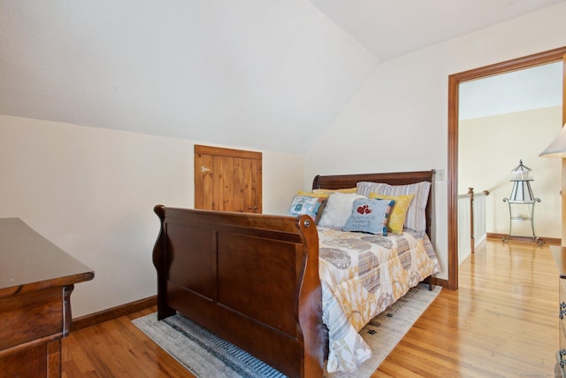 10 Colonial Dr, Clinton, CT 06413 - bedroom with light wood-style floors, vaulted ceiling, and baseboards