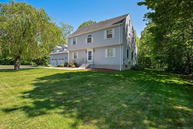 10 Colonial Dr, Clinton, CT 06413 - colonial home featuring a front lawn, a garage, and driveway