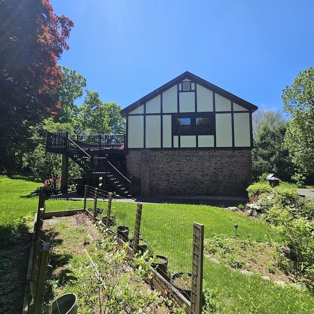 37 Judy Ln, Wolcott, CT 06716 - view of property exterior featuring brick siding, stairway, a deck, and a lawn