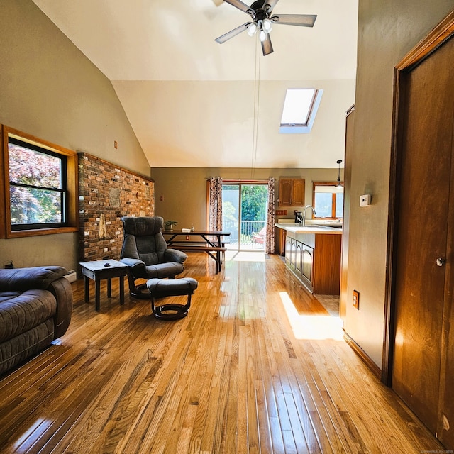 37 Judy Ln, Wolcott, CT 06716 - living room with light wood-style flooring, a ceiling fan, lofted ceiling, and a skylight