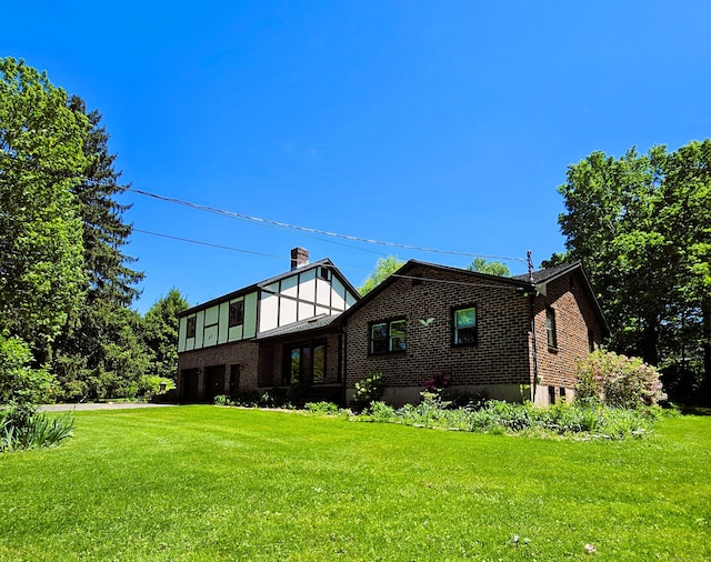 37 Judy Ln, Wolcott, CT 06716 - back of property featuring brick siding and a yard