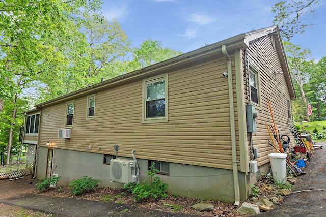 8 Sycamore Rd, East Lyme, CT 06357 - view of side of property with a cooling unit and an AC wall unit