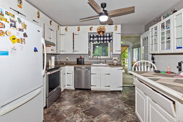 8 Sycamore Rd, East Lyme, CT 06357 - kitchen with stainless steel appliances, a sink, under cabinet range hood, ceiling fan, and white cabinetry
