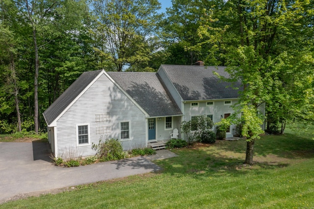 455 Milton Rd, Goshen, CT 06756 - view of front of home with a shingled roof, a front yard, and a chimney
