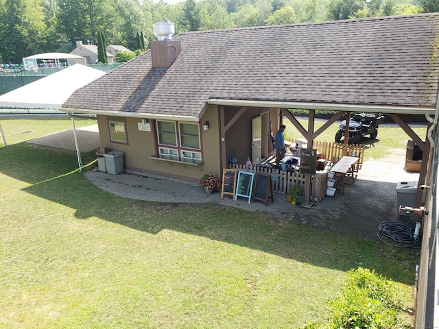 455 Milton Rd, Goshen, CT 06756 - rear view of property with a shingled roof, a patio, and a chimney