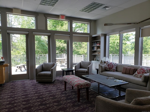 455 Milton Rd, Goshen, CT 06756 - carpeted living room with plenty of natural light, a towering ceiling, and a paneled ceiling