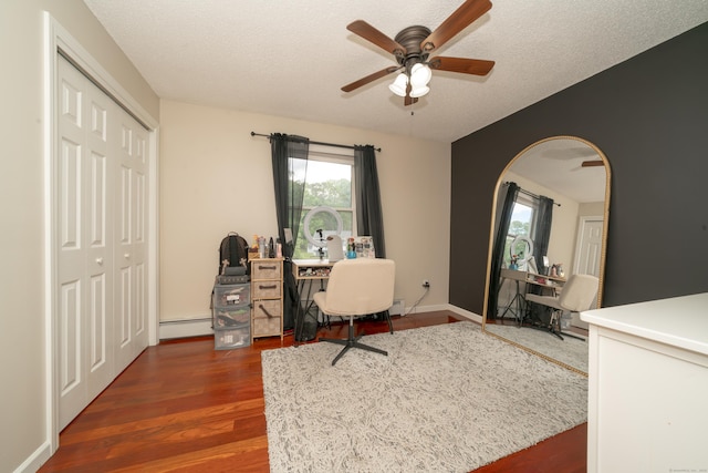 56 Buena Vista Dr, East Hartford, CT 06118 - office area featuring ceiling fan, wood finished floors, a baseboard heating unit, arched walkways, and a textured ceiling