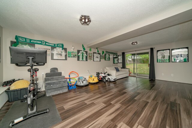 56 Buena Vista Dr, East Hartford, CT 06118 - workout area featuring wood finished floors and a textured ceiling