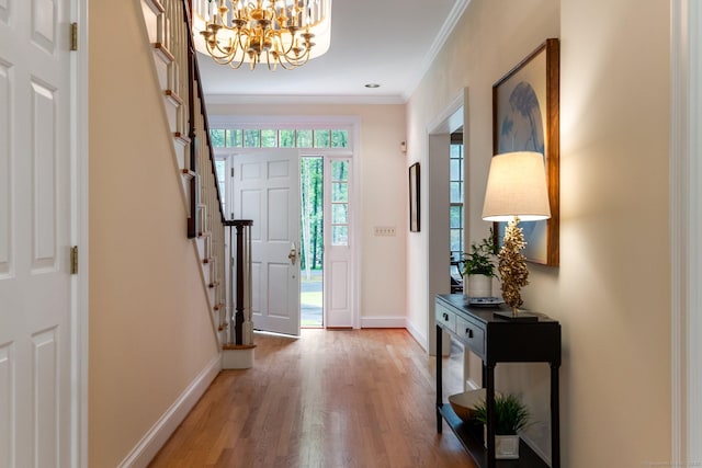 14 Fernhurst, Farmington, CT 06032 - foyer featuring a chandelier, light wood-type flooring, crown molding, baseboards, and stairs