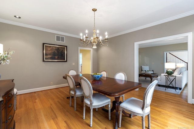 14 Fernhurst, Farmington, CT 06032 - dining room with light wood finished floors, a chandelier, crown molding, and baseboards