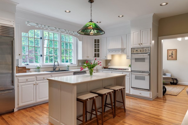 14 Fernhurst, Farmington, CT 06032 - kitchen with double oven, high end fridge, a sink, light wood-type flooring, and recessed lighting
