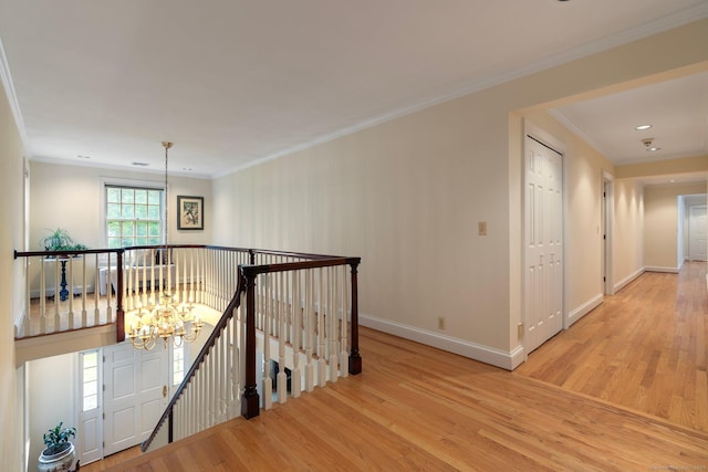 14 Fernhurst, Farmington, CT 06032 - hall with an upstairs landing, wood finished floors, a chandelier, baseboards, and crown molding