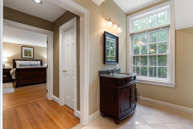 14 Fernhurst, Farmington, CT 06032 - bathroom featuring vanity, baseboards, ornamental molding, and wood finished floors