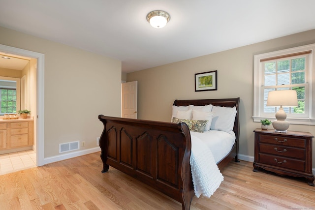 14 Fernhurst, Farmington, CT 06032 - bedroom with light wood-style floors, connected bathroom, and baseboards