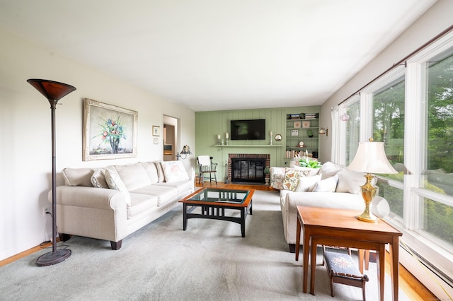 5 Old Bethel Rd, Newtown, CT 06470 - living area with a baseboard heating unit and a brick fireplace