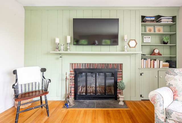 5 Old Bethel Rd, Newtown, CT 06470 - detailed view of wood finished floors and a brick fireplace