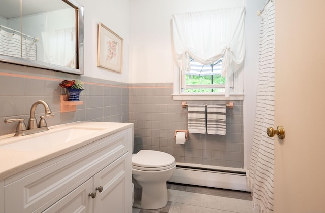 5 Old Bethel Rd, Newtown, CT 06470 - full bath featuring baseboard heating, toilet, vanity, tile walls, and wainscoting