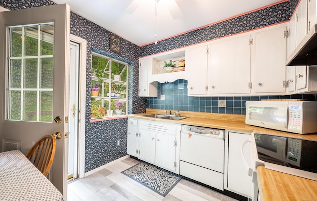 5 Old Bethel Rd, Newtown, CT 06470 - kitchen with white appliances, wallpapered walls, a sink, light countertops, and white cabinetry