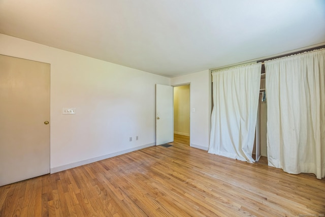 200 Willow St, Hamden, CT 06518 - unfurnished bedroom with light wood finished floors and baseboards