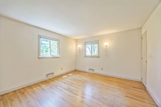 200 Willow St, Hamden, CT 06518 - spare room featuring plenty of natural light, wood finished floors, and baseboards