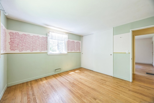 200 Willow St, Hamden, CT 06518 - unfurnished bedroom with hardwood / wood-style flooring and a closet