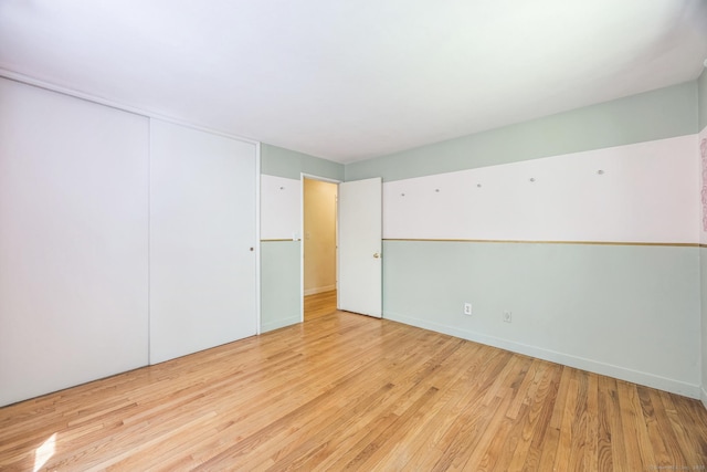 200 Willow St, Hamden, CT 06518 - unfurnished bedroom with wood finished floors and a closet
